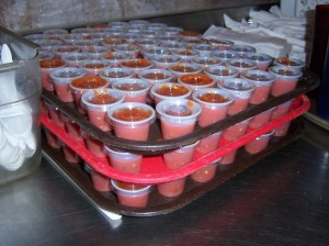 Photo of containers of salsa ready for take out.