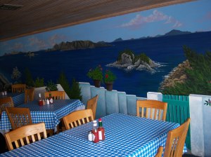 Photo of Greek islands mural on the wall of Demo's Greek Food.