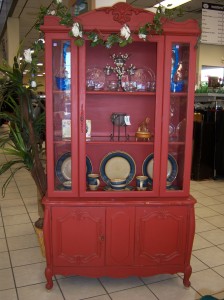 Photo of a red china cabinet.