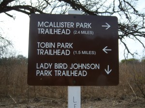 Photo of the sign along the trail with distances.